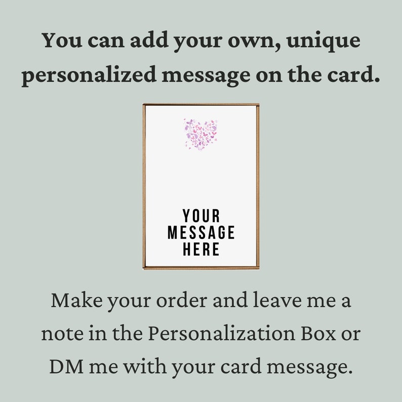 May include: A white card with a pink heart design and the text "YOUR MESSAGE HERE". The card is framed in a brown frame.