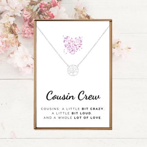May include: A silver necklace with a tree of life pendant and a card that reads "Cousin Crew. Cousins: A little bit crazy, a little bit loud, and a whole lot of love."