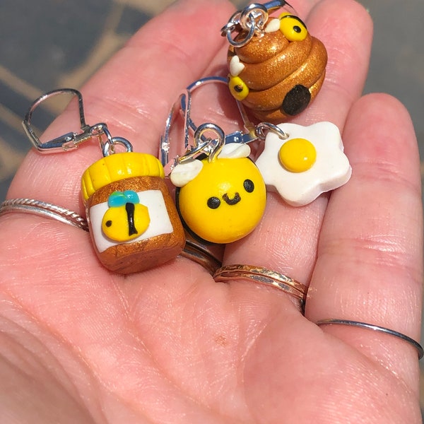 Honey bee stitch marker set of four stitch markers. Jar of honey, flower, beehive, and bumblebee!
