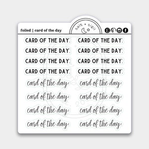 May include: A sheet of stickers with the text "card of the day" repeated multiple times in different sizes and styles. The stickers are on a white background and have a light green outline.