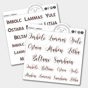 May include: A set of stickers with the names of the eight pagan holidays: Imbolc, Ostara, Beltane, Lammas, Mabon, Samhain, Yule, and Litha. The stickers are white with black text and are arranged in two rows. The stickers are on a white background.