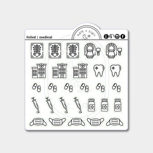 May include: A sticker sheet with various medical-themed icons in black and white. The icons include X-ray images, MRI machines, hospitals, teeth, pills, syringes, medicine bottles, and face masks. The text "foiled | medical" is at the top.