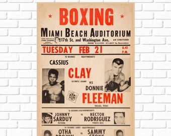 Op de afbeelding: Een vintage boxingposter die een gevecht tussen Cassius Clay en Donnie Fleeman in het Miami Beach Auditorium op dinsdag 21 februari adverteert. De poster bevat zwart-witfoto's van de boksers en de details van het evenement in rode en zwarte tekst.