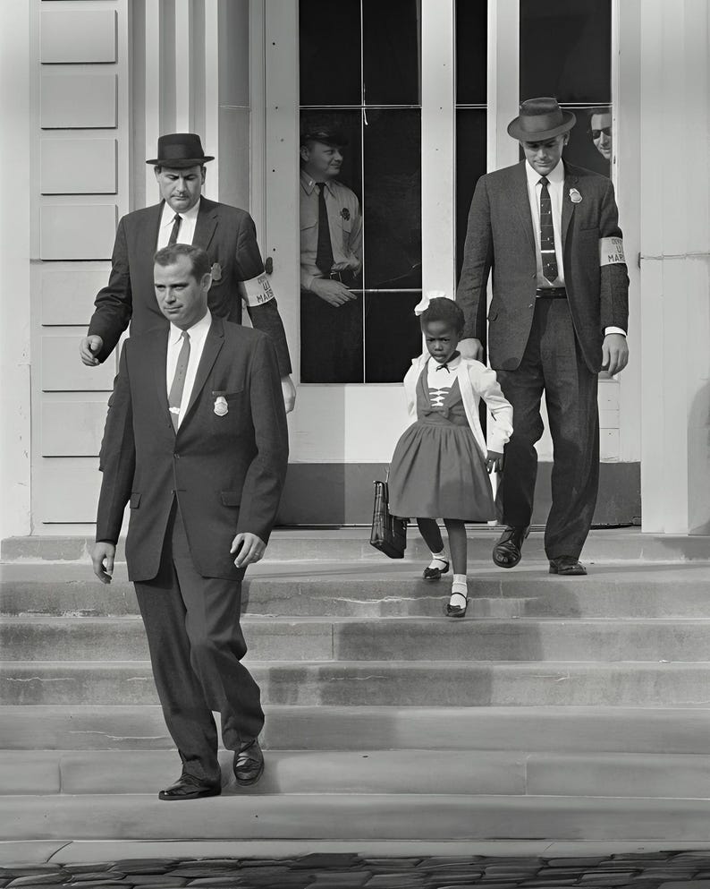 May include: A young girl in a dress and carrying a book bag walks down a set of stairs with two men in suits and hats. The men are wearing armbands that say "U.S. Marshal".