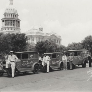 May include: Three vintage delivery trucks with the words 
