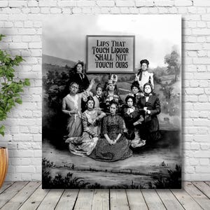 May include: Black and white photograph of a group of women holding a sign that reads 
