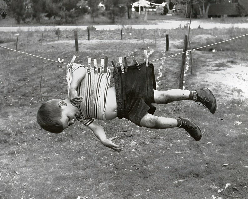 Photo of a boy clipped to a clothesline in black and white. Humorous Gift idea for Laundry Room