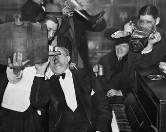 May include: A group of men are gathered around a piano, drinking from a barrel and a large beer stein. One man is leaning back on the piano, with his mouth open as if he is singing. The piano has a sign that reads "Ferris Trading Company".