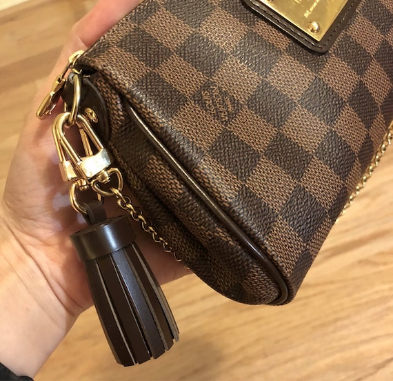 lv purse tassel