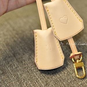 Mcraft® handmade personalized vachetta leather key bell purse bag charm. hang tag to decorate bags