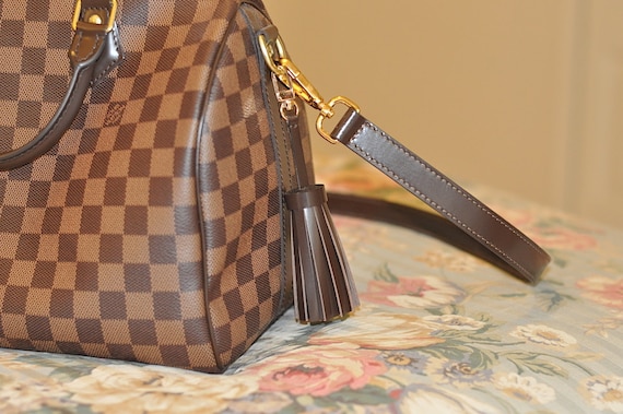 lv purse tassel