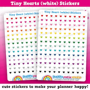 May include: Two sticker sheets with tiny, colorful heart stickers. Each sheet has rows of red, pink, orange, yellow, green, blue, purple, gray, and black hearts. The text "Tiny Hearts (white) Stickers" is at the top. The bottom text reads "cute stickers to make your planner happy!"