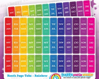 May include: Rainbow-colored month page tab stickers with the months of the year printed on them. The stickers are rectangular with rounded corners and are arranged in rows. The text "Month Page Tabs - Rainbow" is also visible.