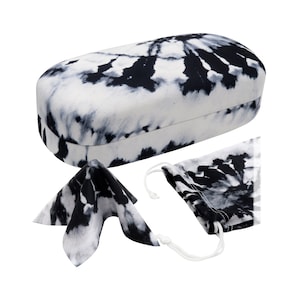 May include: A black and white tie-dye patterned glasses case, cleaning cloth, and drawstring pouch.