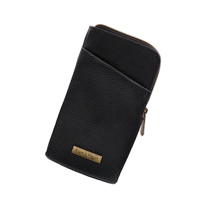May include: Black leather zippered pouch with a gold zipper and a gold label that reads "Rust & Violet".