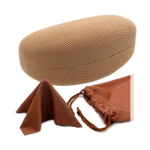 May include: A brown, oval-shaped, padded case for sunglasses, a brown microfiber cleaning cloth, and a brown drawstring pouch.