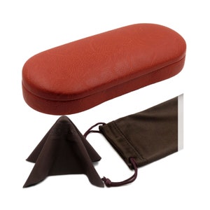 May include: A red leather glasses case with a brown microfiber cleaning cloth and a brown drawstring pouch.