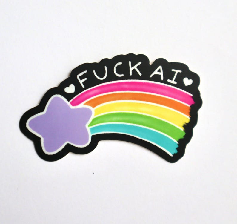 A sticker of a purple shooting star with a rainbow tail that has the works "F-ck AI" above it with two hearts on either side of the text.