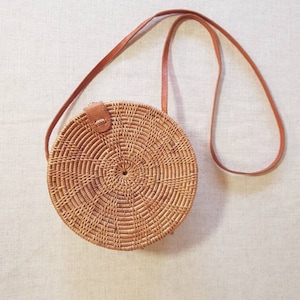 Brown round rattan bag, ata grass circle bag across the body shoulder bag.Bali art Handwoven natural wicker purse Womens Summer handbag 2025