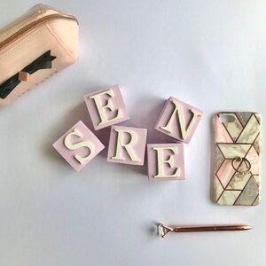 Pink and white 5cm wooden name blocks for babies and children.