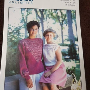 May include: A knitting pattern for "Smock-Knit" sweaters, featuring two women wearing pink and white sweaters. The pattern includes sizes for children aged 2-12 and women sizes 6-24. The pattern is from Smocking Unlimited.