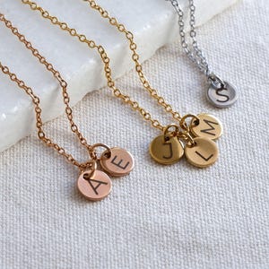 Personalised initial necklaces in gold, rose gold and silver with engraved letter charms – custom gift for her.” (Hits “personalised initial necklace” and “engraved letter” keywords while describing the image