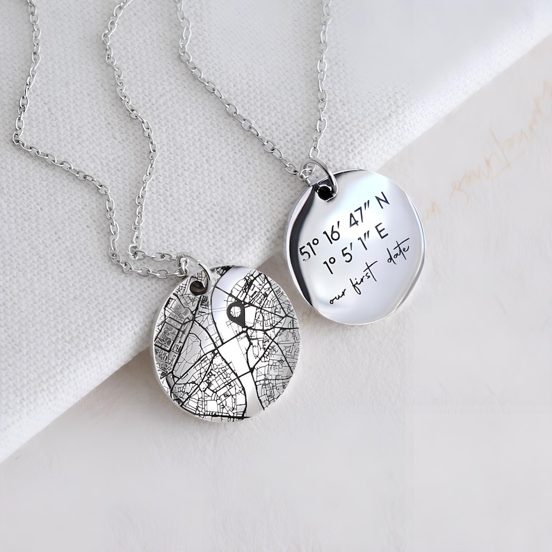 Personalized map necklace in silver, stainless steel with engraved city map detail pendant and custom coordinates pendant.