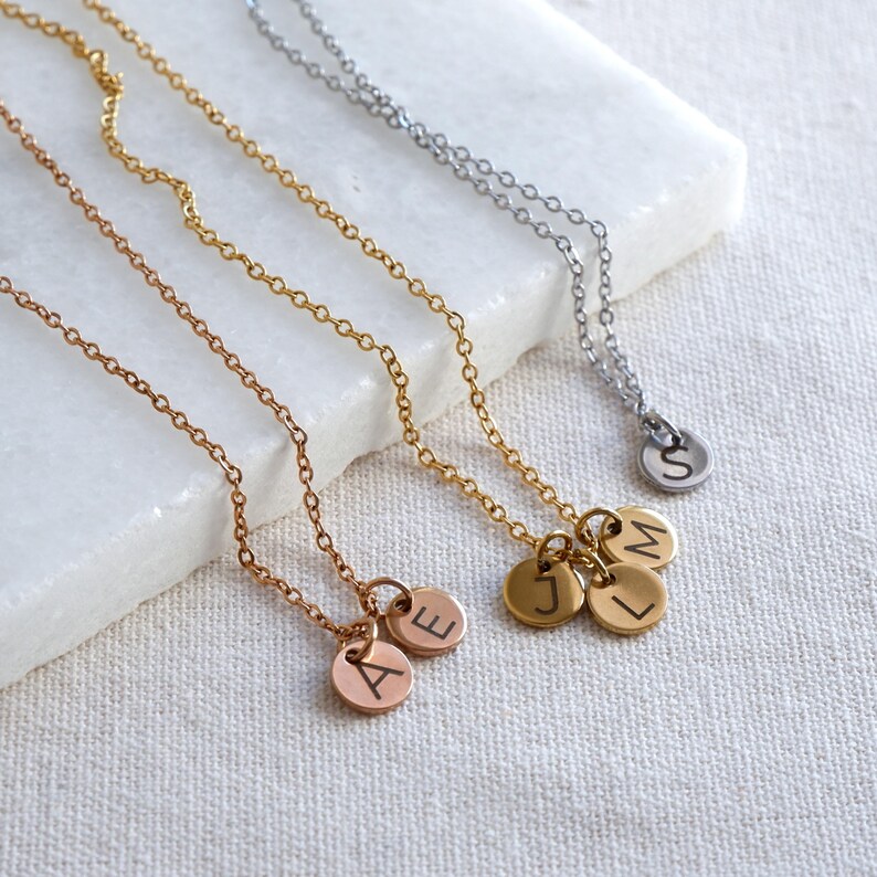 Personalised initial necklaces in gold, rose gold and silver with engraved letter charms – custom gift for her.” (Hits “personalised initial necklace” and “engraved letter” keywords while describing the image
