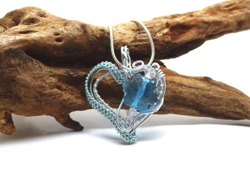 Heart pendant with blue crystal snowflake in silver and blue