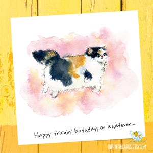 May include: A watercolour birthday card with a fluffy calico cat illustration on a pink and white background. The card has the text "Happy frickin' birthday, or whatever..." in black. The Etsy shop's logo is in the bottom right corner.