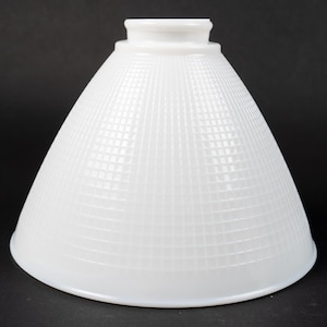 May include: White glass lampshade with a grid pattern. The shade is cone-shaped and has a smooth, frosted finish.