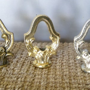 Antique Brass, Chrome or Polished Brass Finish Decorative Loop or Finial 2" tall 1 1/2" w tapped 1/8"ips.