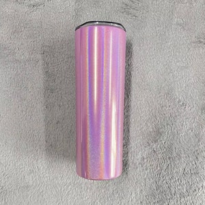 May include: A pink iridescent stainless steel tumbler with a silver lid.