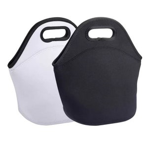 May include: Two neoprene lunch bags, one white and one black, with a handle at the top. The bags have a rounded shape and are designed to keep food items insulated. The bags are suitable for carrying lunches to work or school.