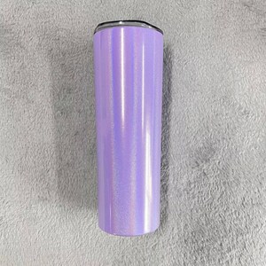 May include: A tall, stainless steel tumbler with a purple iridescent finish. The tumbler has a black lid and a silver band around the top.