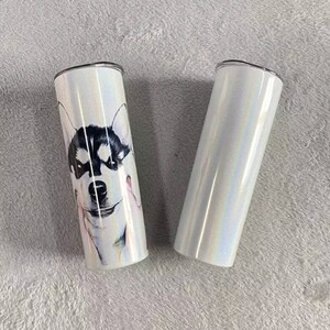 May include: Two stainless steel tumblers, one with a white iridescent finish and the other with a white iridescent finish and a black and white image of a husky dog's face.