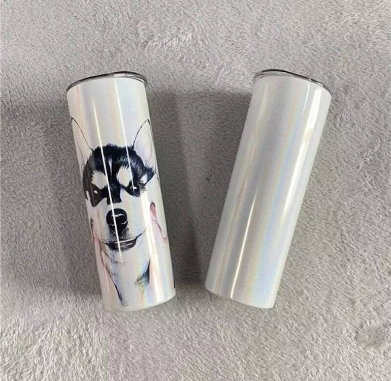 May include: Two stainless steel tumblers, one with a white iridescent finish and the other with a white iridescent finish and a black and white image of a husky dog's face.