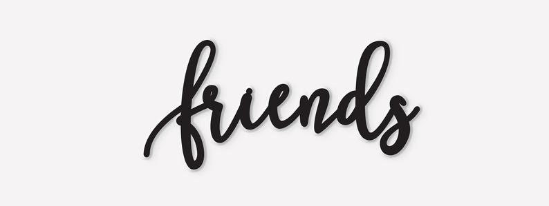 May include: Black and white cursive script spelling out the word "friends".