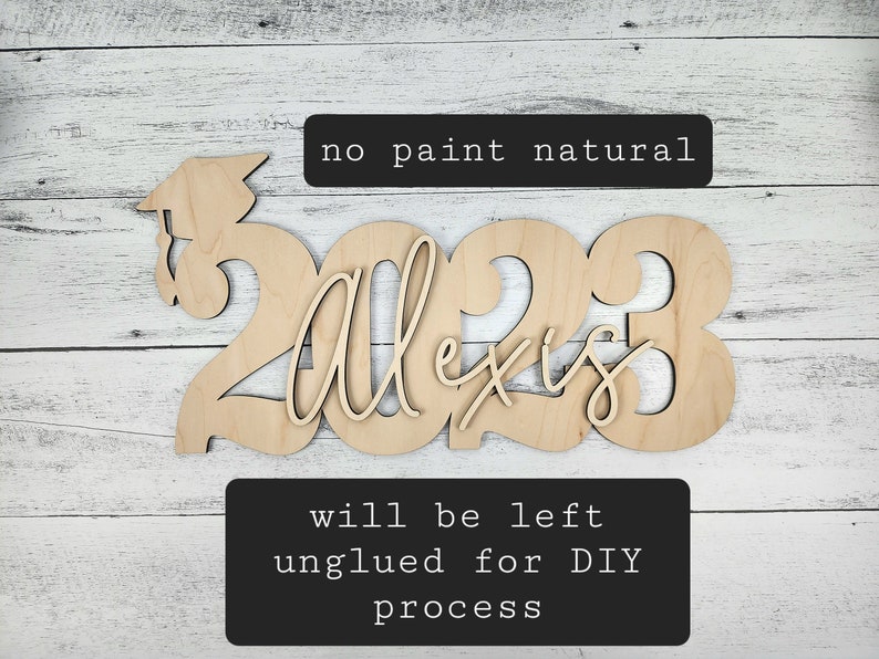 May include: Unpainted wooden cutout of the year 2023 with the name Alexis in cursive script. The cutout is designed for a graduation celebration. The text "no paint natural" and "will be left unglued for DIY process" is included in the image.
