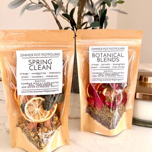 May include: A set of three ceramic mugs with a speckled, matte finish. The mugs are in shades of cream, light brown, and dark brown. Each mug has a simple, minimalist design, perfect for coffee or tea.