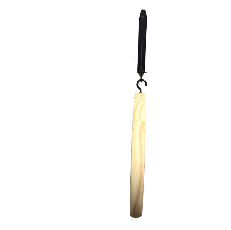 May include: A wooden embroidery hoop with a black metal hanging hook. The hoop is made of natural wood and has a smooth finish.