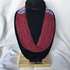 red seed bead multi strand necklace with woven button clasp