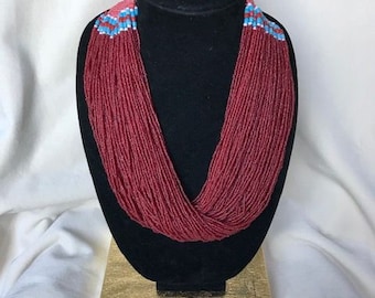 red seed bead multi strand necklace with woven button clasp