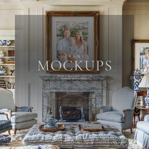 Grand millennial living room wall art mockup with ornate gold frame above marble fireplace, bone white walls, blue chairs, and family portrait display