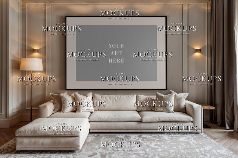 Blank contemporary living room wall art mockup with large horizontal black frame, taupe wall trim, cream sectional sofa, lamps, curtains, and neutral decor