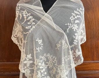 A length of antique Brussels applique lace border trimming in ivory.