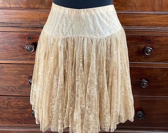 A vintage lace short skirt in a caramel cream colour.