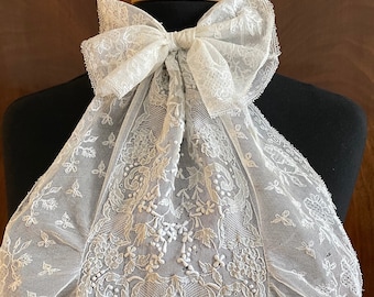 A lovely antique lace jabot in white.