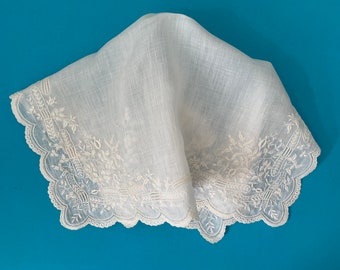 A beautiful antique whitework handkerchief on fine lawn in ivory.