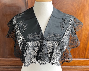 An antique Victorian black silk and lace collar.